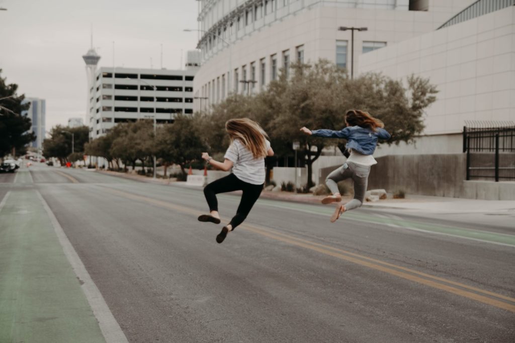 Satisfaction of a Human Design Generator
two woman jumping on the street during daytime